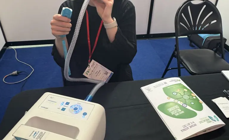 Delegate trialing device at conference  Delegate trialing device at conference